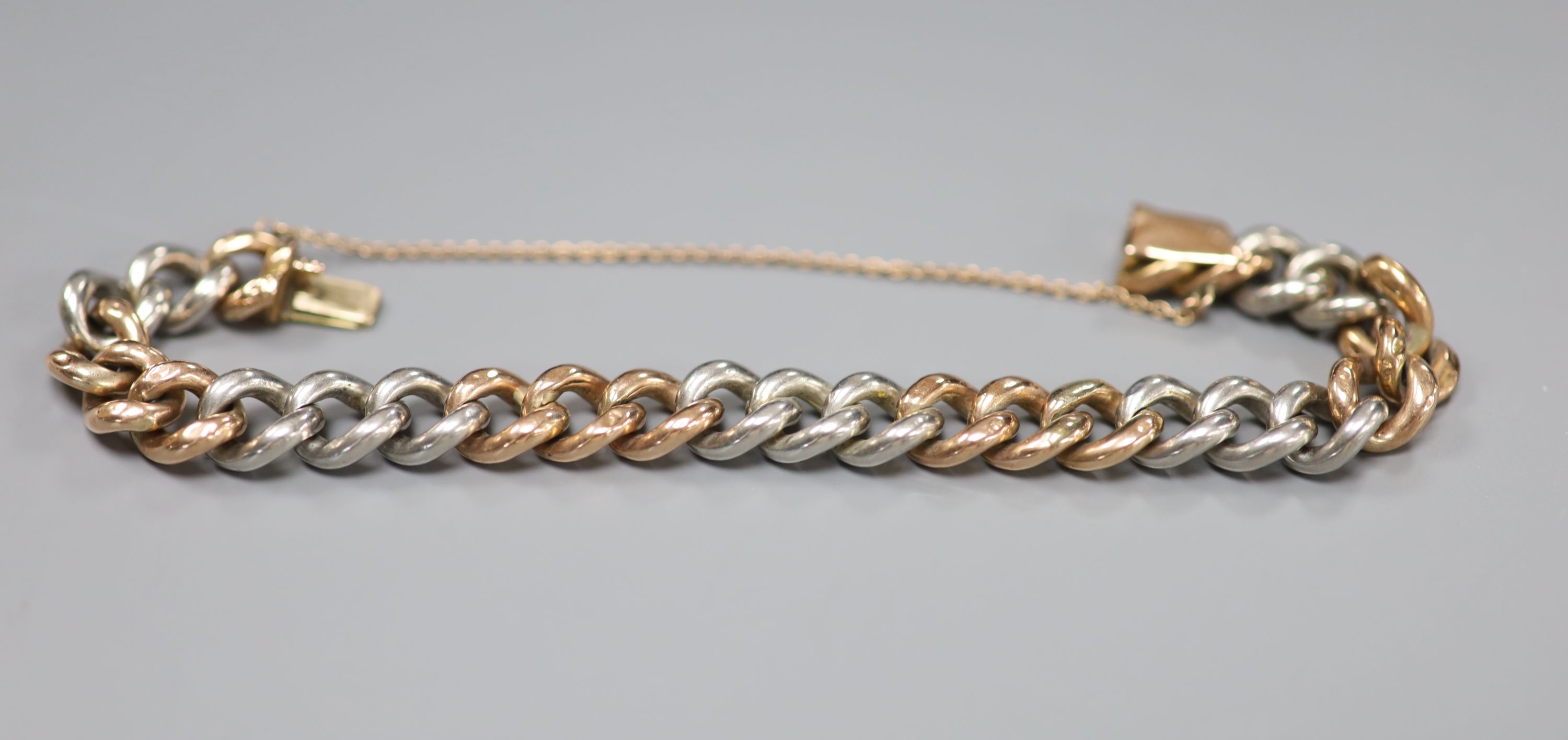 A yellow and white metal curblink bracelet (a.f.),